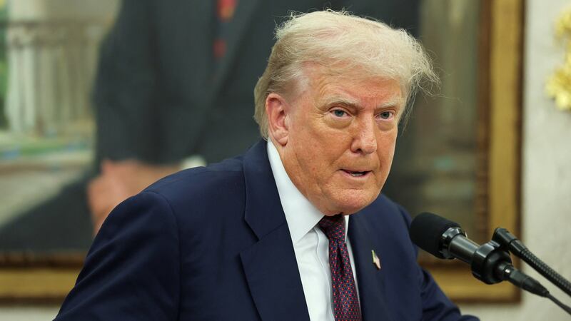 U.S. President Donald Trump speaks, as he and Apple CEO Tim Cook (not pictured) present Apple's announcement of a $100 billion investment in U.S. manufacturing, in the Oval Office at the White House in Washington, D.C., U.S., August 6, 2025. REUTERS/Jonathan Ernst