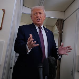 IN FLIGHT - JANUARY 22: U.S. President Donald Trump speaks to reporters on board Air Force One while flying in between Ireland and Washington as he returns from the World Economic Forum on January 22, 2026. Following a meeting with NATO Secretary General Mark Rutte, Trump announced a deal with European leaders on the semi-autonomous Danish territory of Greenland during the annual meeting of political and business leaders in Davos. (Photo by Chip Somodevilla/Getty Images)