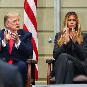 Donald Trump and first lady Melania Trump clap during a ceremony commemorating the 25th anniversary of the September 11th terrorist attacks in the courtyard of the Pentagon on September 11, 2026 in Arlington, Virginia.