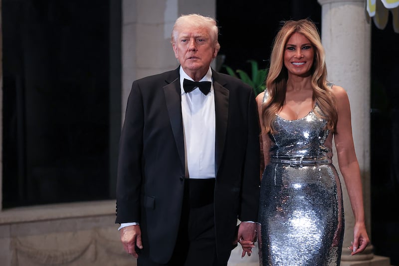 U.S. President Donald Trump and first lady Melania Trump arrive for a New Year’s Eve event