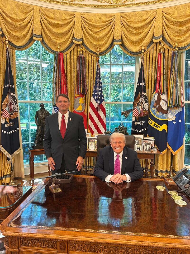 Ed Gallrein's campaign website prominently features a photo with the president in the gold-laden Oval Office.