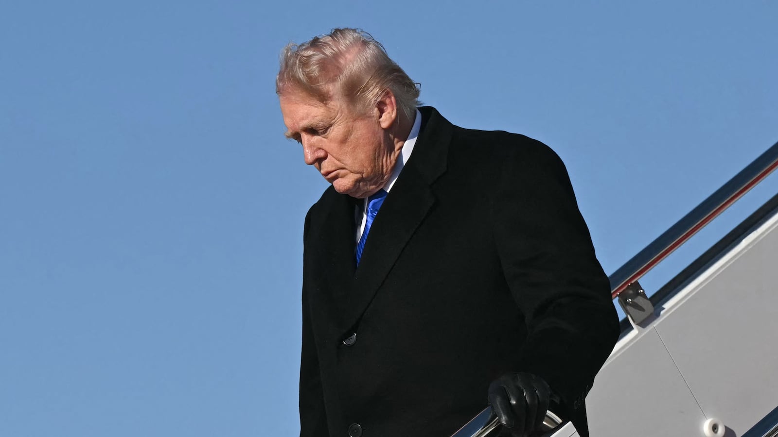 US President Donald Trump disembarks from Air Force One upon arrival at Joint Base Andrews in Maryland, March 23, 2026. Trump is returning to the White House after participating in the Memphis Safe Task Force Roundtable. (Photo by SAUL LOEB / AFP via Getty Images)