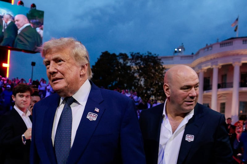 U.S. President Donald Trump arrives with UFC CEO Dana White for UFC Freedom 250 on the South Lawn of the White House in Washington, D.C., U.S., June 14, 2026.