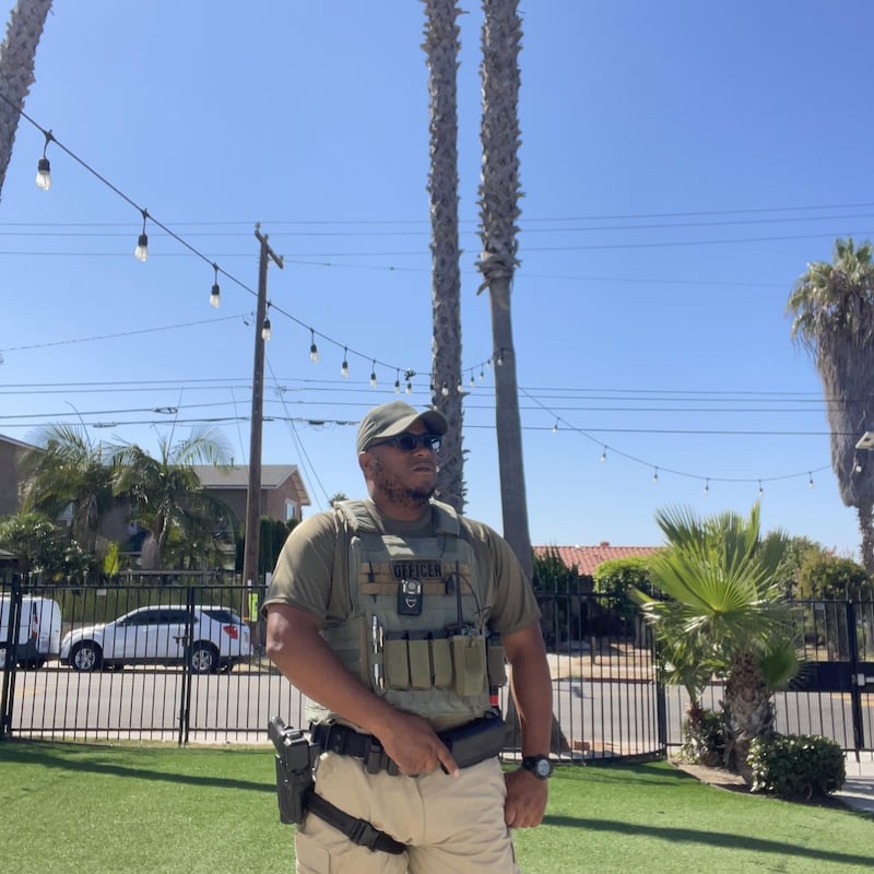 Amin Abdullah, a security guard, stands in the front garden of the Islamic Center of San Diego.
