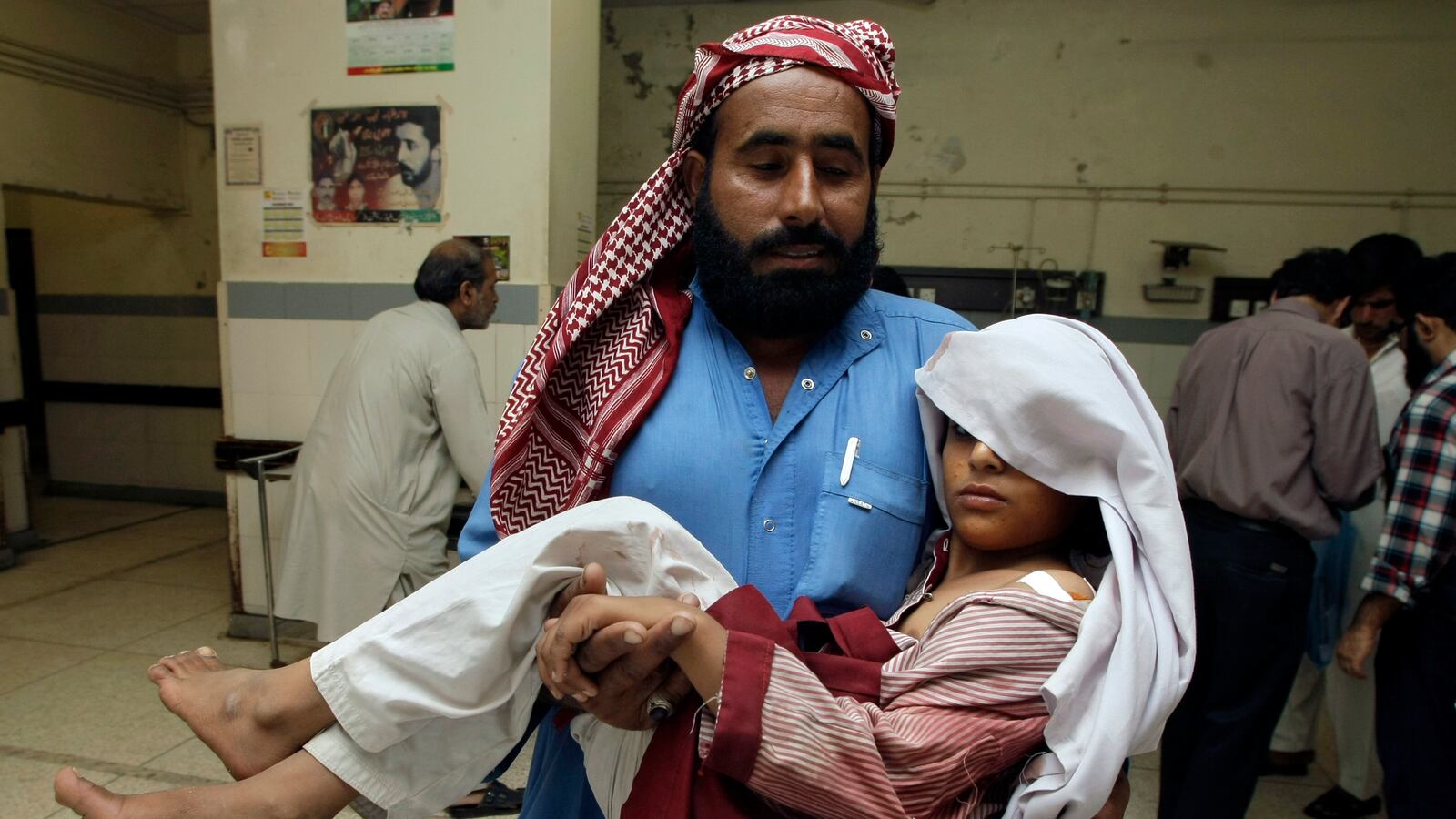 articles/2013/03/30/principal-murdered-in-pakistan-latest-assault-on-girls-schooling/130330-Brown-Schoolkids-Crosshairs-tease_ar3ozk