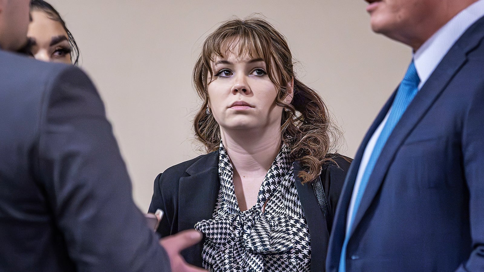Hannah Gutierrez-Reed (C) talks with her attorney Jason Bowles (R) and her defense team during the trial against her in First District Court on March 1, 2024 in Santa Fe, New Mexico