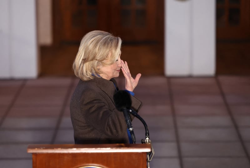 Former Secretary of State Hillary Clinton waves after speaking to the press following her a deposition with the House Oversight Committee as they investigate links to convicted sex offender Jeffrey Epstein, in Chappaqua, New York, on February 26, 2026.