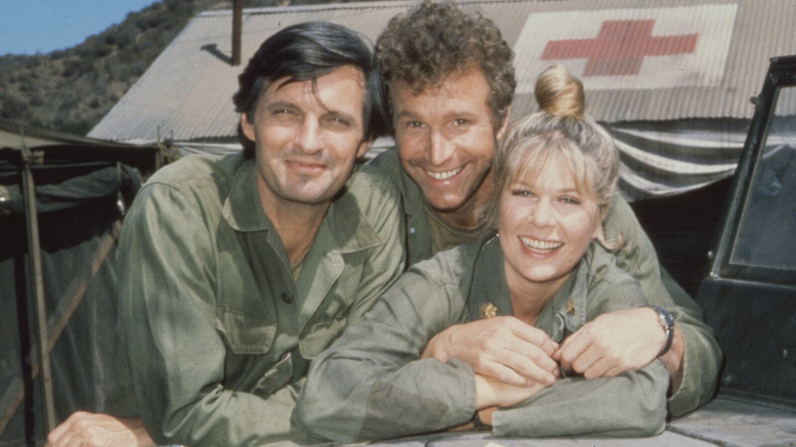 Alan Alda, as Captain Benjamin Hawkeye Pierce, Wayne Rogers, as Captain Trapper John McIntyre, and Loretta Swit, as Major Margaret Houlihan.