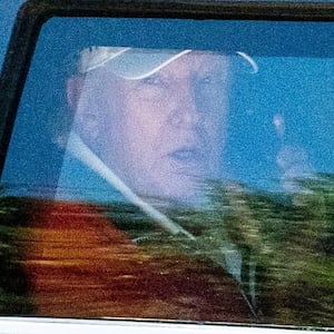 U.S. President Donald Trump talks on the phone as he departs the White House for Trump National Golf Club in Sterling, Virginia, U.S., May 31, 2026. REUTERS/Aaron Schwartz