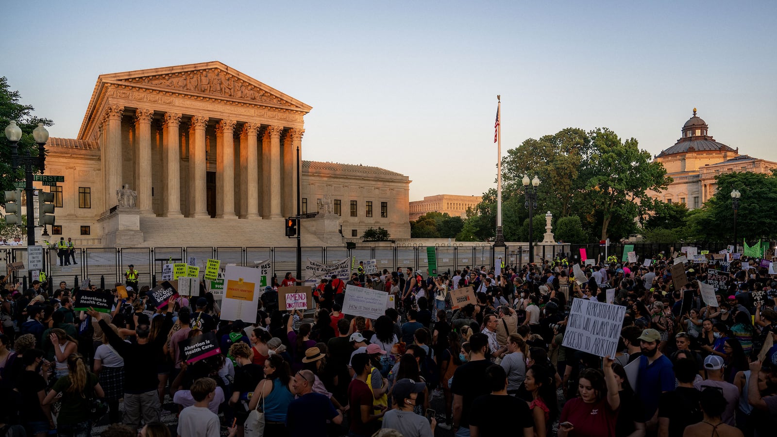 People protest in front of the U.S. Supreme Court in response to the Dobbs v Jackson Women's Health Organization ruling on June 24, 2022 in Washington, DC.