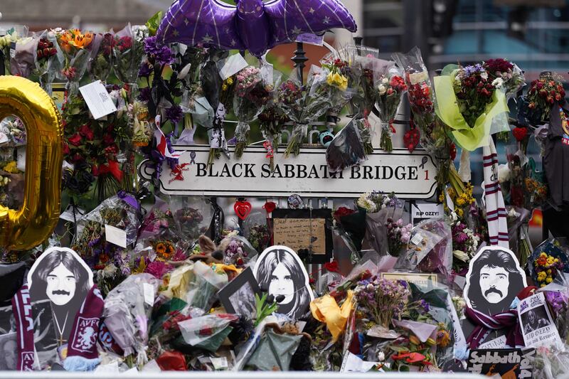 BIRMINGHAM, UNITED KINGDOM - JULY 30: Flowers and notes are seen on the Black Sabbath Bridge in Birmingham, United Kingdom on July 30, 2025, placed ahead of the funeral procession of Ozzy Osbourne, the legendary British heavy metal musician and frontman of Black Sabbath, who passed away at the age of 76. (Photo by Ioannis Alexopoulos/Anadolu via Getty Images)