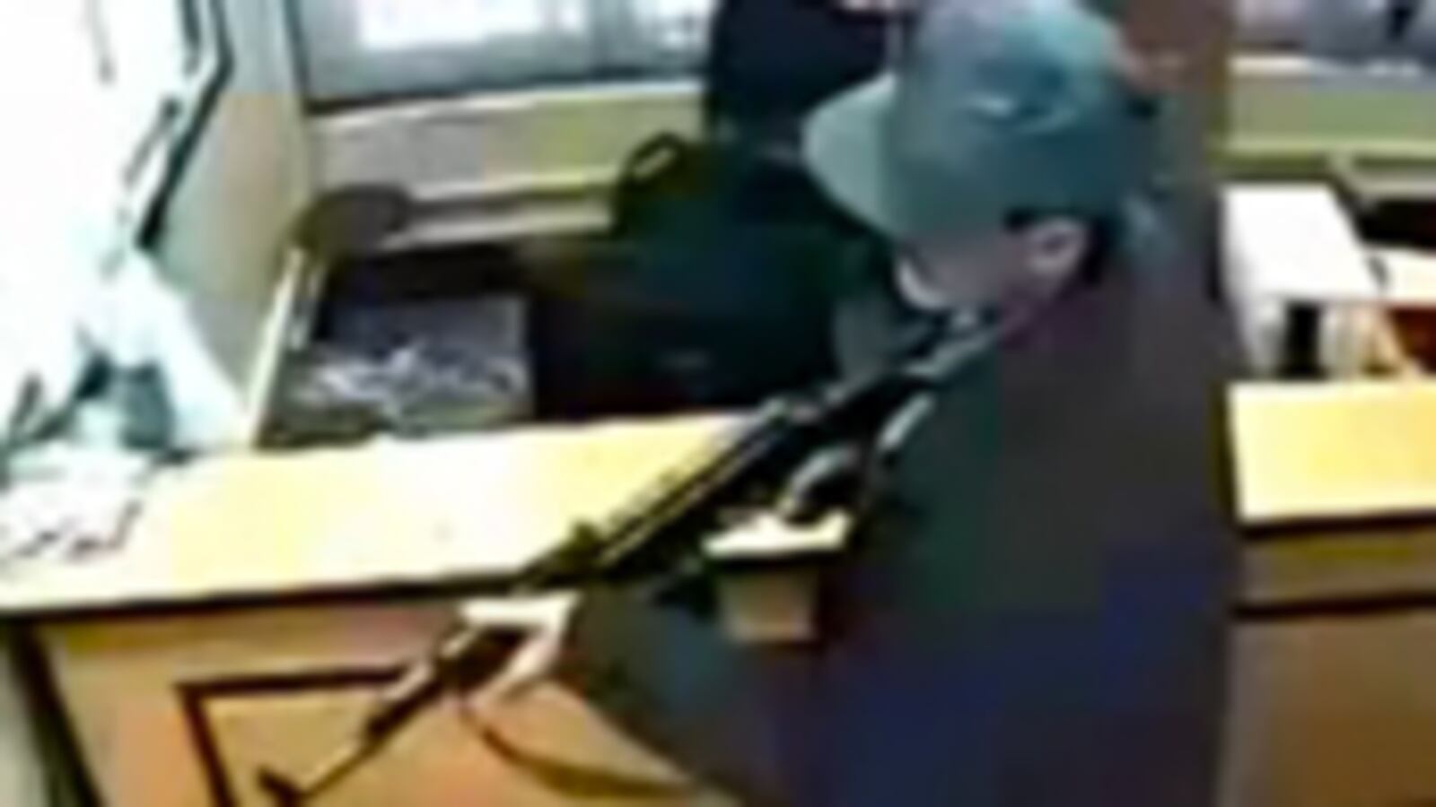 articles/2011/02/24/taliban-attack-video-shows-danger-with-us-negotiations/mosheni-bank-shooting_162186_fofyyn