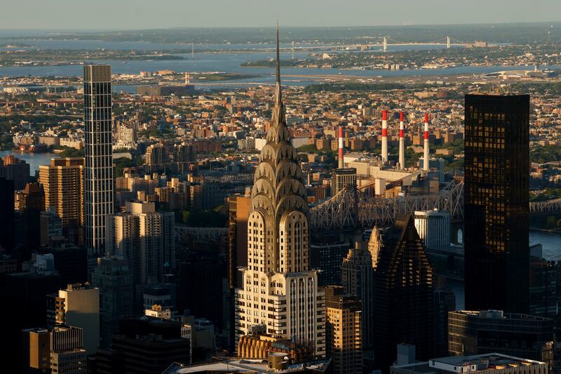 The sun sets on the Chrysler Building as seen from the 86th floor observation deck of the Empire State Building on May 20, 2025, in New York City. (Photo by Gary Hershorn/Corbis via Getty Images)
