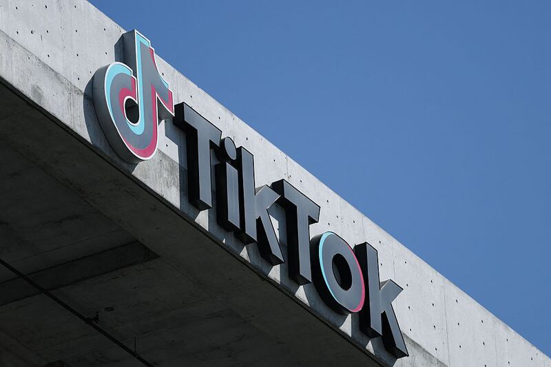 The TikTok logo is displayed on signage outside TikTok social media app company offices in Culver City, California on September 30, 2025. President Donald Trump insists he has found a solution to keep TikTok alive in the United States through a group of investors who will buy the short-video app from its Chinese owners in accordance with US law.
But questions remain unresolved about how this will play out and what it means for American users. (Photo by Patrick T. Fallon / AFP) (Photo by PATRICK T. FALLON/AFP via Getty Images)