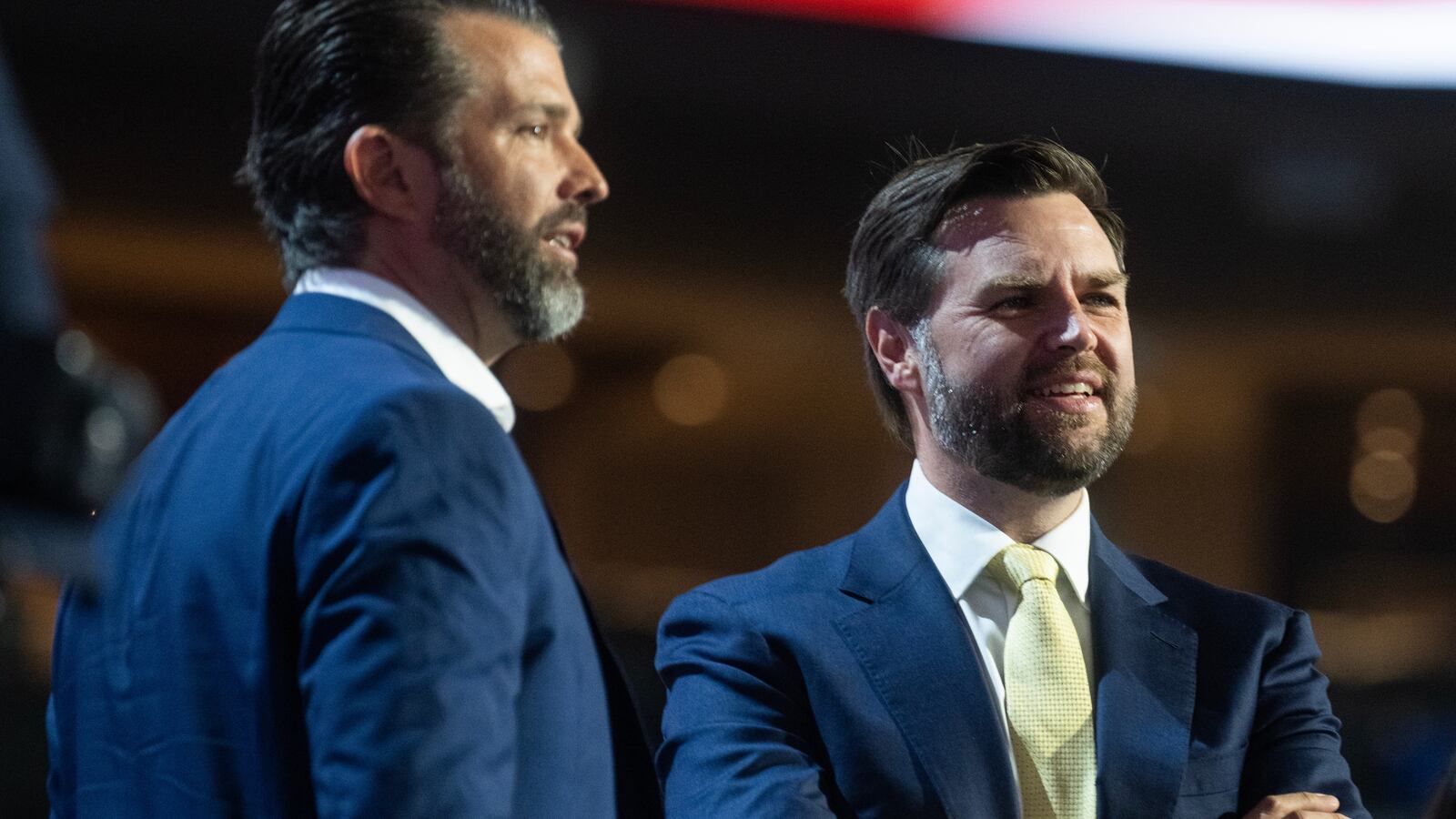 J.D. Vance (right) and Donald Trump Jr., are seen on stage during a sound check before the second day of the Republican National Convention in Milwaukee, Wis., on July 16, 2024.