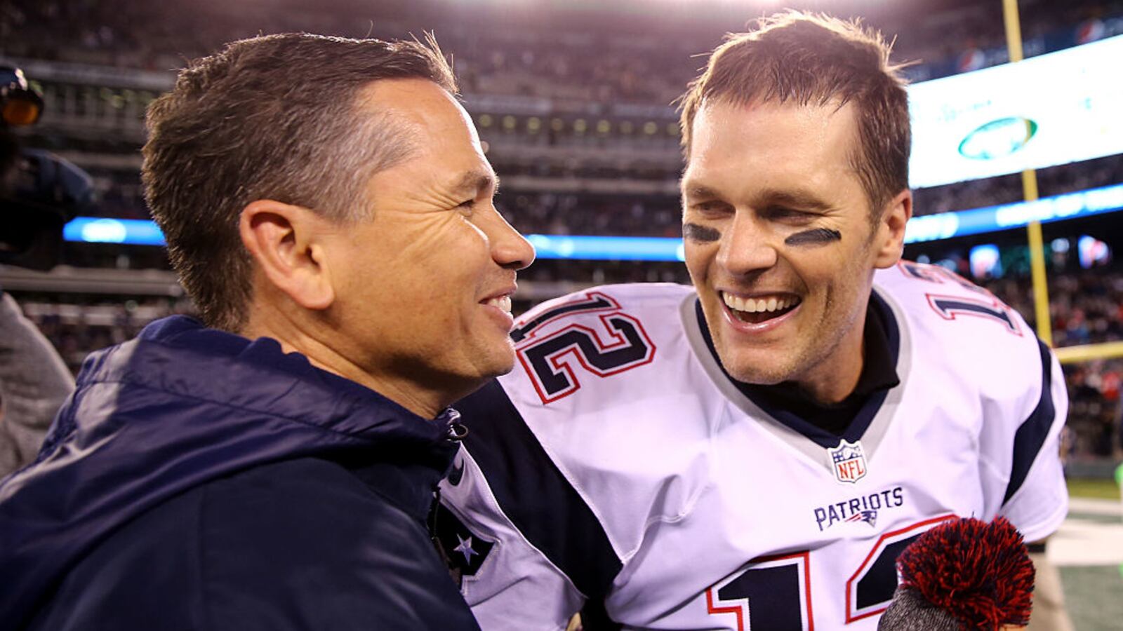 Tom Brady embraces his trainer Alex Guerrero after winning a game in 2016.