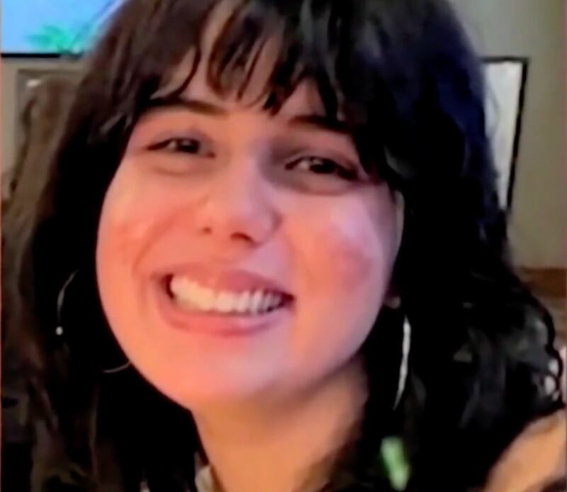 A family photograph of a smiling Katie Abraham.