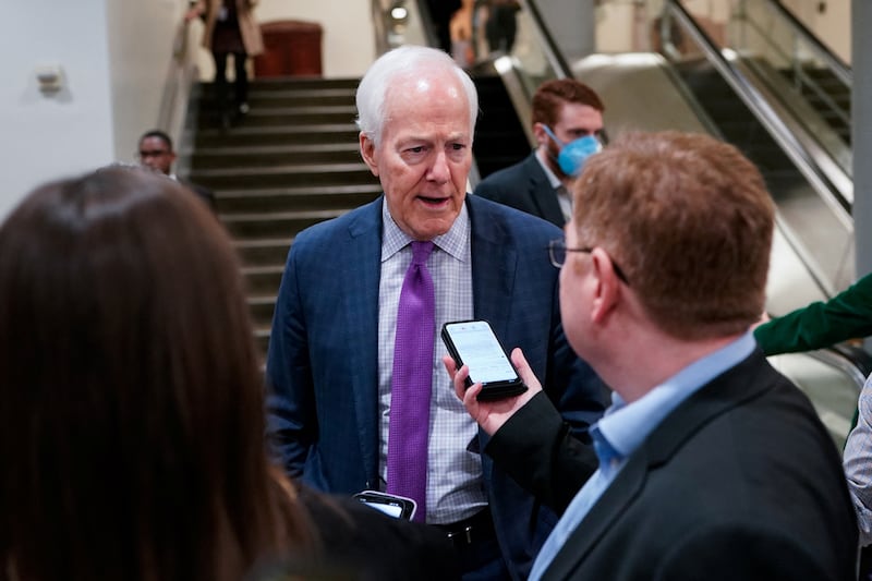 U.S. Senator John Cornyn (R-TX) speaks to reporters in the Senate subway during a vote at the U.S. Capitol in Washington, D.C., U.S., March 12, 2026. REUTERS/Elizabeth Frantz