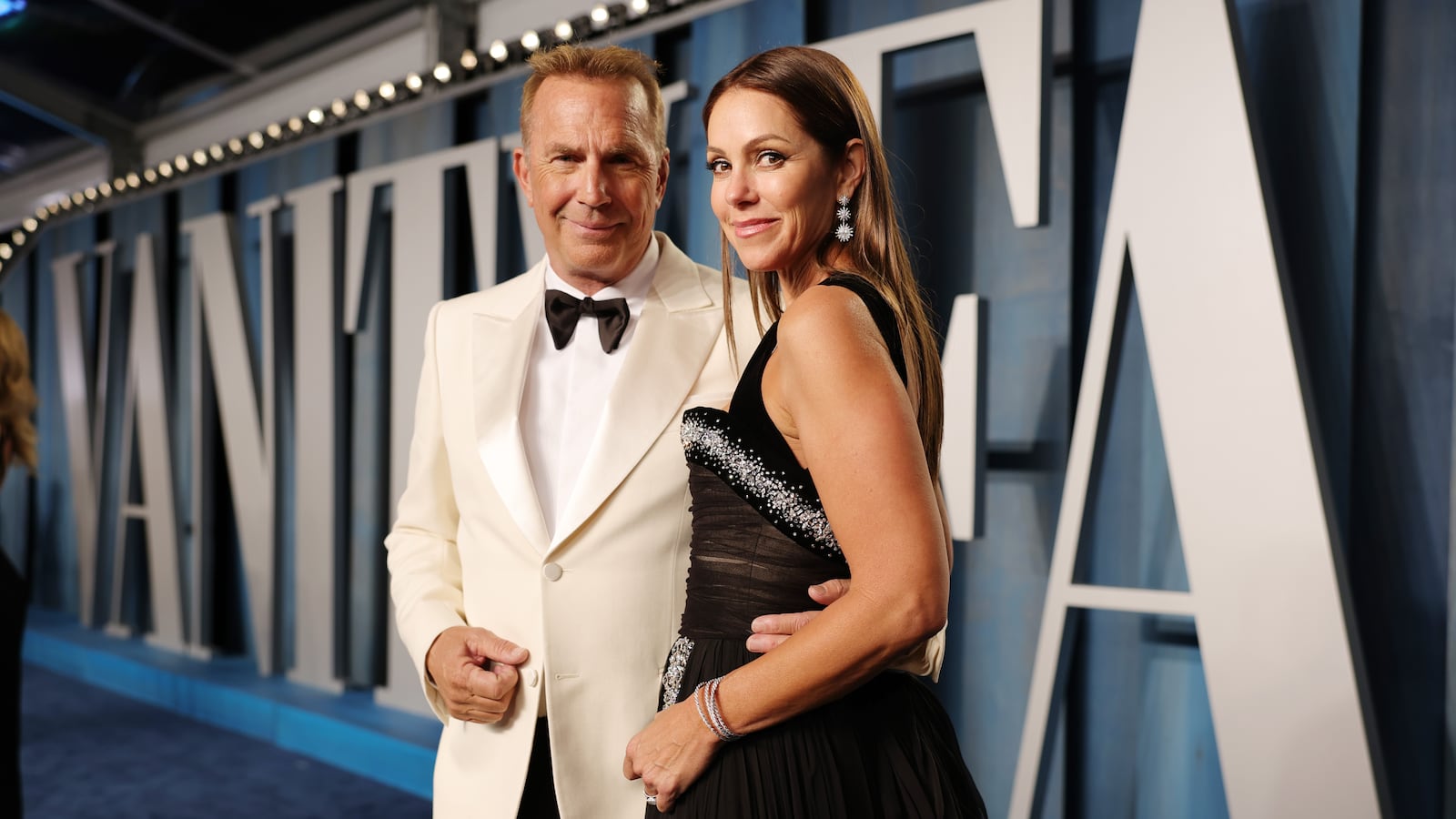 Kevin Costner and Christine Baumgartner attend the 2022 Vanity Fair Oscar Party