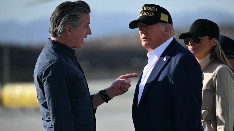 Donald Trump and First Lady Melania Trump are greeted by California Governor Gavin Newsom upon arrival at Los Angeles International Airport in Los Angeles, California, on January 24, 2025.