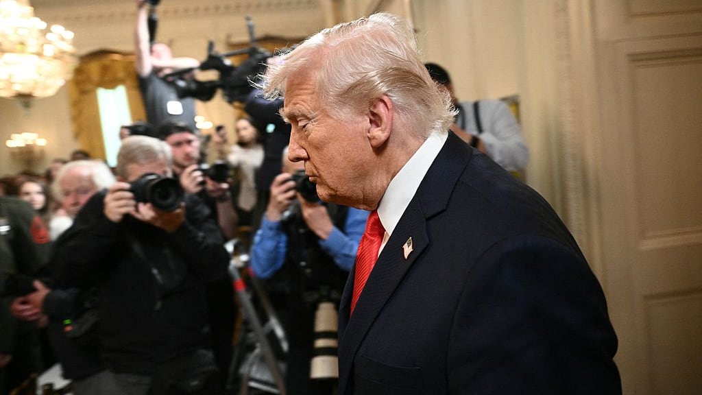 US President Donald Trump arrives at a ceremony to present the Commander-in-Chief's Trophy to the US Naval Academy football team, the Navy Midshipmen, in the East Room of the White House on April 15, 2025 in Washington, DC.