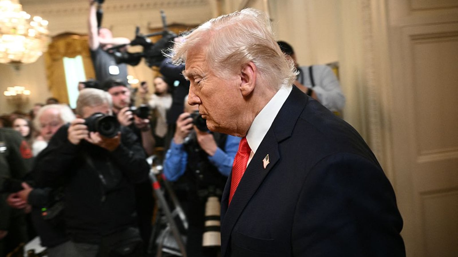 US President Donald Trump arrives at a ceremony to present the Commander-in-Chief's Trophy to the US Naval Academy football team, the Navy Midshipmen, in the East Room of the White House on April 15, 2025 in Washington, DC.