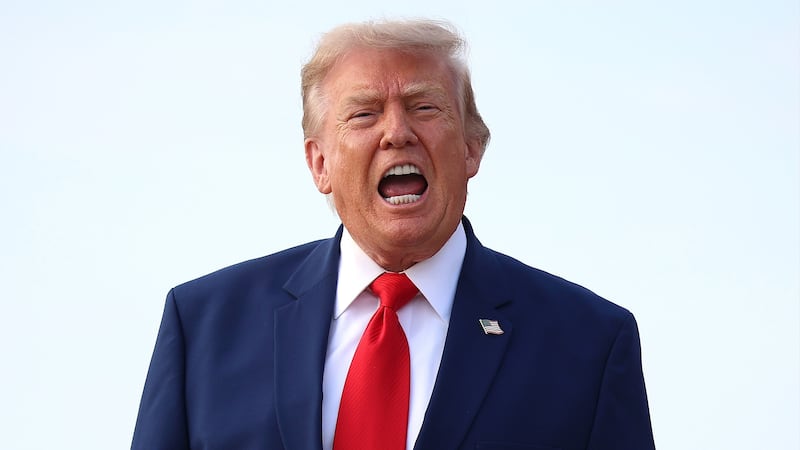 JOINT BASE ANDREWS, MARYLAND - JULY 22: U.S. President Donald Trump calls out to reporters after getting off Air Force One on July 22, 2026 at Joint Base Andrews, Maryland. Trump is returning from attending a dignified transfer at Dover Air Force Base and a rally in Georgia.  (Photo by Kevin Dietsch/Getty Images)