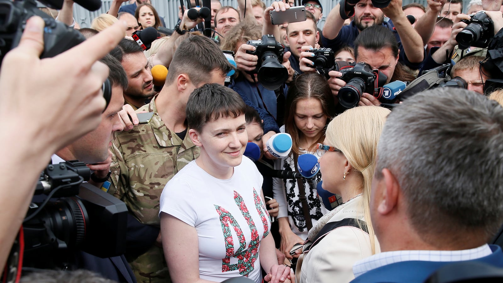 articles/2016/05/25/russia-frees-feisty-woman-fighter-pilot-nadiya-savchenko/160525-nemstoca-pilot-pardoned-tease_hozdpx