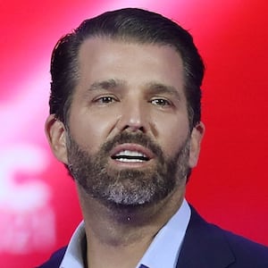 Don Trump Jr. and Kimberly Guilfoyle stand on stage as they address the Conservative Political Action Conference being held in the Hyatt Regency on February 26, 2021 in Orlando, Florida.