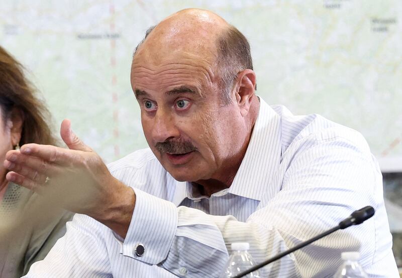 Dr. Phil McGraw flatters President Donald Trump in Kerrville, Texas.