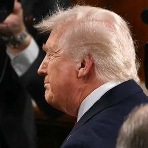 President Donald Trump shakes hands with Supreme Court Chief Justice John Roberts as he arrives to deliver his State of the Union address in the House Chamber of the US Capitol in Washington, DC, on February 24, 2026.
