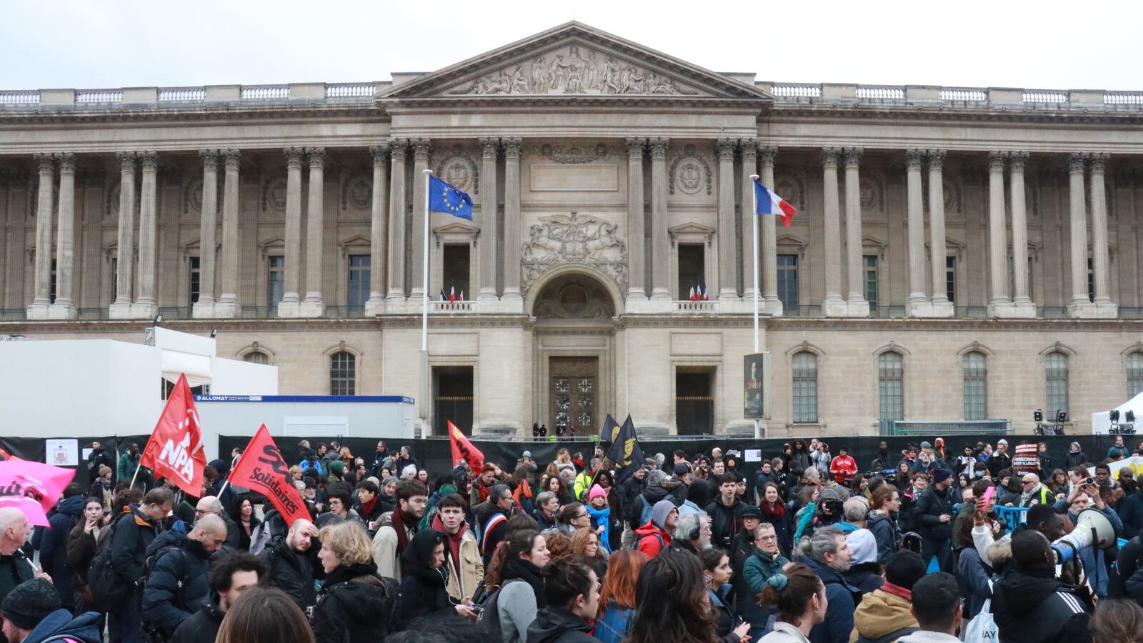 Protestors gather to demonstrate as they hold banners to call for the withdrawal of the immigration law at the Constitutional Council in Paris, France on January 25, 2024.