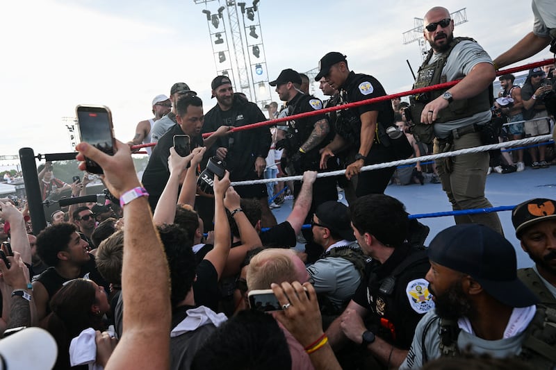 UFC Middleweight Champion Sean Strickland is removed by law enforcement, at the UFC Fan Fest on the Ellipse near the White House, on the day of UFC Freedom 250, in Washington, D.C., U.S., June 14, 2026. REUTERS/Matt McClain