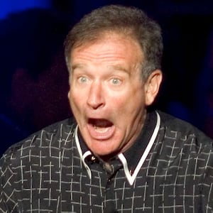 Comedian Robin Williams performs at the ninth annual Andre Agassi Charitable Foundation "Grand Slam for Children" benefit concert at the MGM Grand Garden Arena in Las Vegas, Nevada October 2, 2004. The event raises money to assist less fortunate children in Agassi's hometown of Las Vegas. REUTERS/Ethan Miller  EM/GB