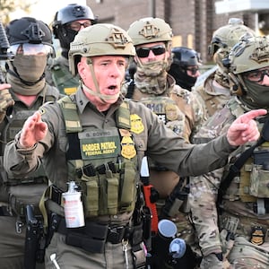 Border Patrol Chief Gregory Bovino of the El Centro Sector stands amid a protest outside an ICE facility in Broadview