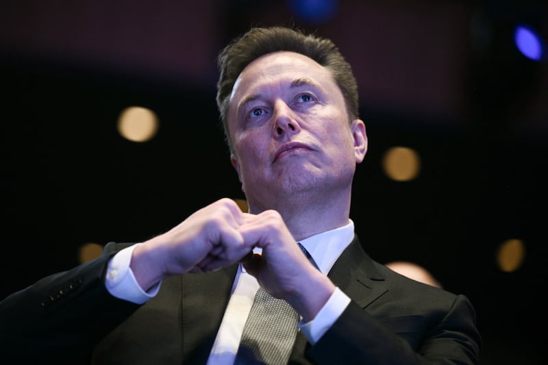Elon Musk looks on as US President Donald Trump speaks at the US-Saudi Investment Forum at the John F. Kennedy Center for the Performing Arts in Washington, DC on November 19, 2025.