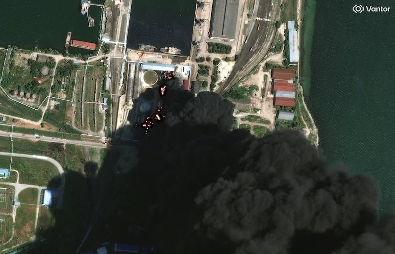 A satellite image shows fire and smoke rising from oil tanks, after what Ukrainian President Volodymyr Zelenskiy said was an attack on an oil depot in the city of Kerch, Crimea, June 21, 2026. Vantor/Handout via REUTERS. THIS IMAGE HAS BEEN SUPPLIED BY A THIRD PARTY. NO RESALES. NO ARCHIVES. MANDATORY CREDIT. DO NOT OBSCURE LOGO.