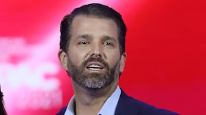 Don Trump Jr. and Kimberly Guilfoyle stand on stage as they address the Conservative Political Action Conference being held in the Hyatt Regency on February 26, 2021 in Orlando, Florida.