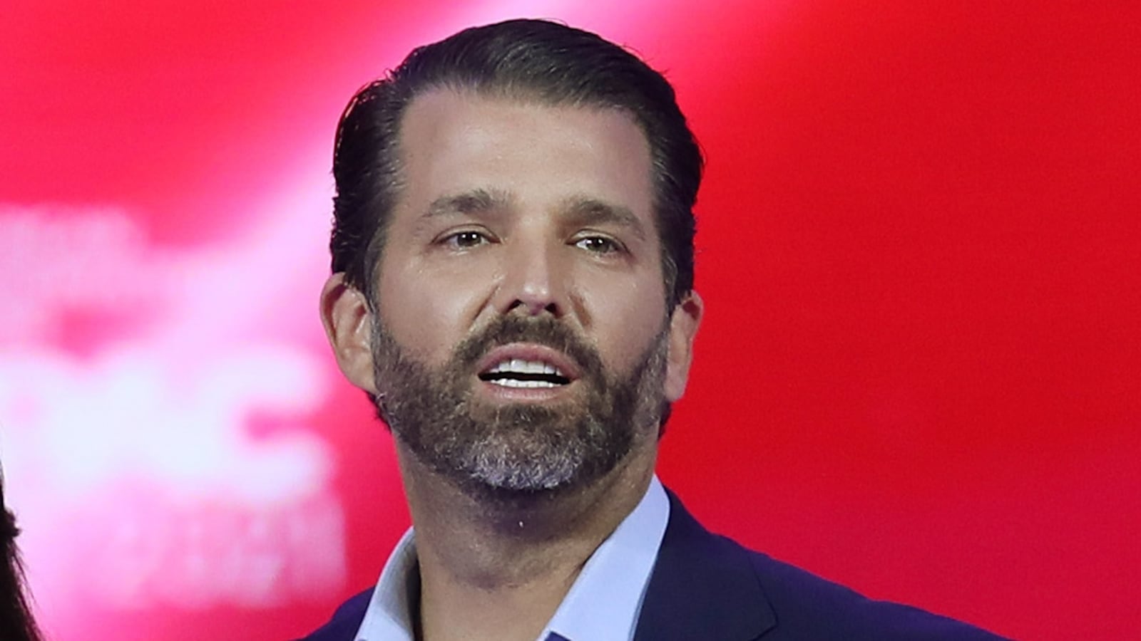 Don Trump Jr. and Kimberly Guilfoyle stand on stage as they address the Conservative Political Action Conference being held in the Hyatt Regency on February 26, 2021 in Orlando, Florida.