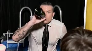 Pete Hegseth drinks champagne in a dunk tank during a Fox News 2023 New Year's segment.