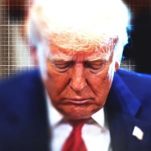 Donald Trump looking down with graph paper in the background