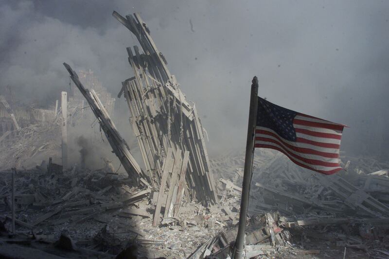 Am American flag flies near the base of the destroyed World Trade
Center in New York, September 11, 2001.