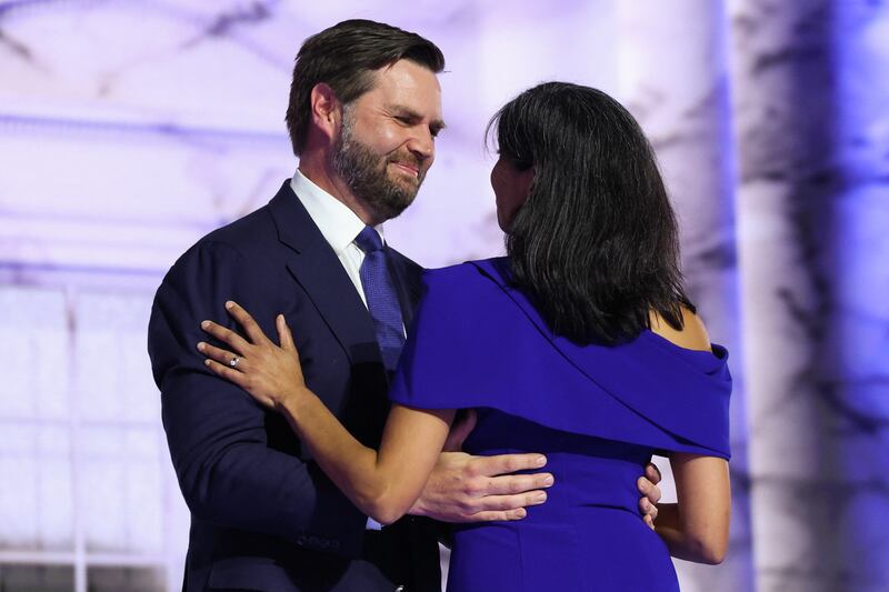 Usha Vance and her husband, U.S. Senator J.D. Vance, embrace onstage during the Republican National Convention in Milwaukee, Wisconsin on July 17, 2024.