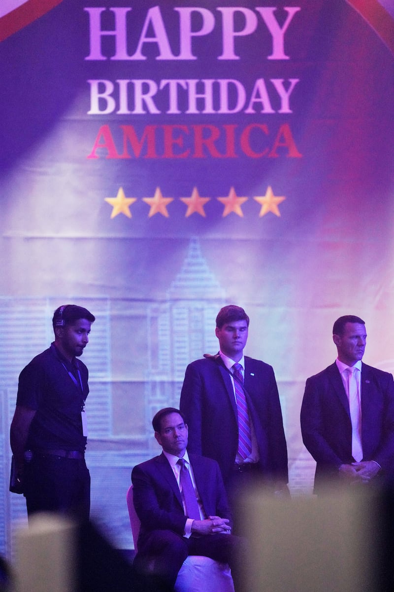 U.S. Secretary of State Marco Rubio sits in a chair as he attends an event celebrating the United States' 250th anniversary, at the Bharat Mandapam convention center, in New Delhi, India, Sunday, May 24, 2026.
