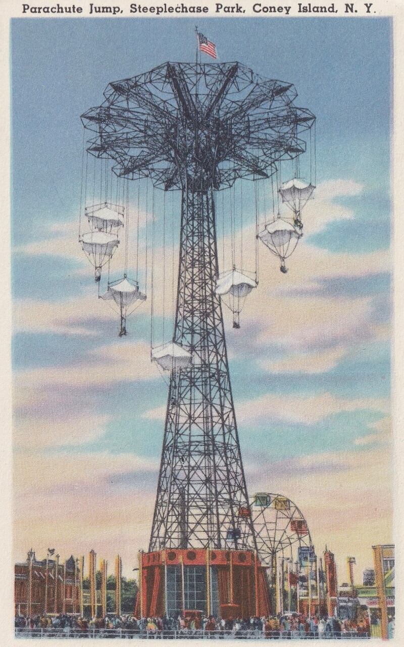 Coney Island Amusement Park, Beach and Boardwalk, and the famous Parachute Jump ride, with the Ferris Wheel Wonder Wheel in the background at Steeplechase Park, Coney Island, Brooklyn, in 1940.