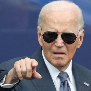 Former U.S. President Joe Biden gestures during a dedication ceremony for the opening of the Obama Presidential Center, in Chicago, Illinois, U.S., June 18, 2026. REUTERS/Brendan McDermid