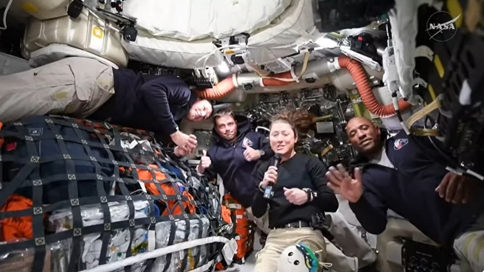 Artemis II crew members Jeremy Hansen, Reid Wiseman, Christina Koch, and Victor Glover answer questions from reporters during the first downlink event of their mission.