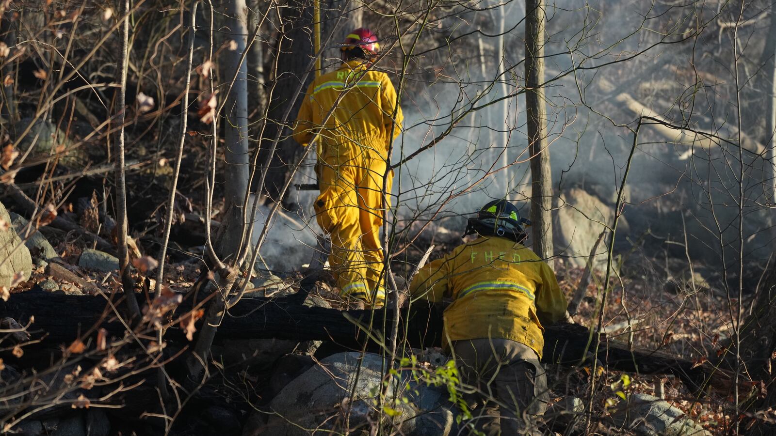 Firefighters extinguish a wildfire in Greenwood Lake, New York