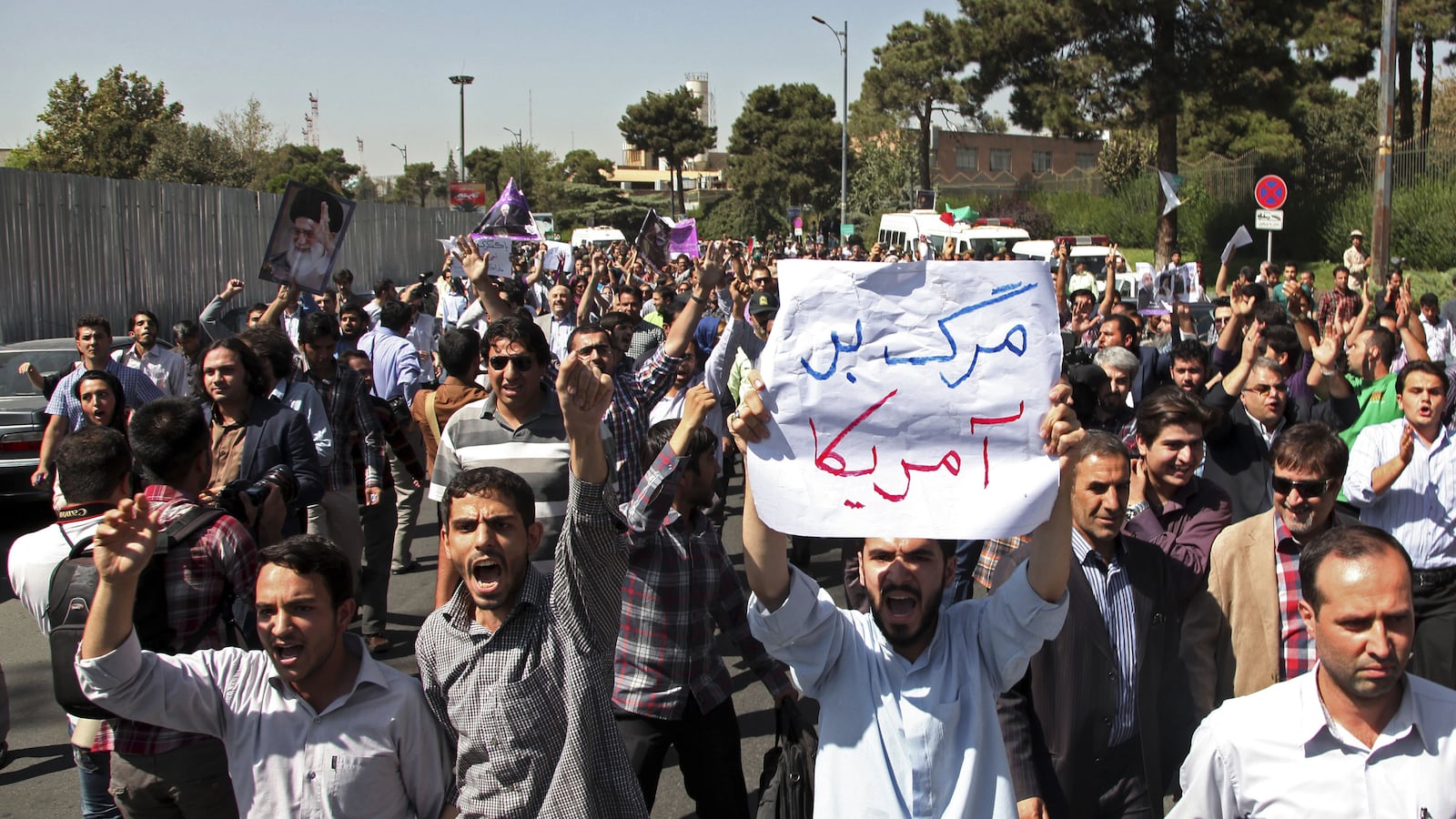 cheats/2013/09/28/iranian-president-returns-to-protests/130928-hassan-cheat_pc5ass