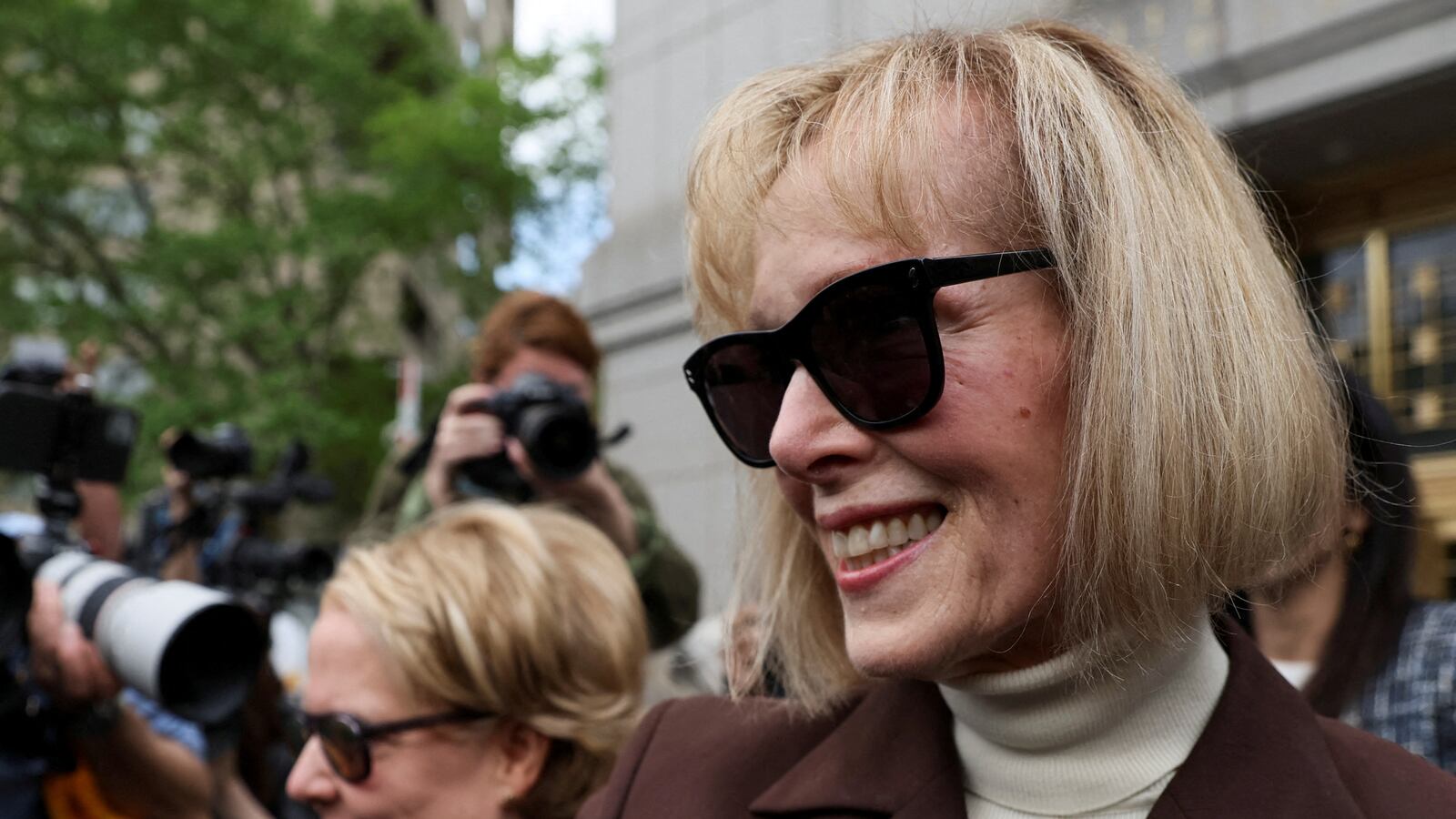 E. Jean Carroll reacts as she exits the Manhattan Federal Court following the verdict in the civil rape accusation case against former U.S. President Donald Trump, in New York City, U.S., May 9, 2023.